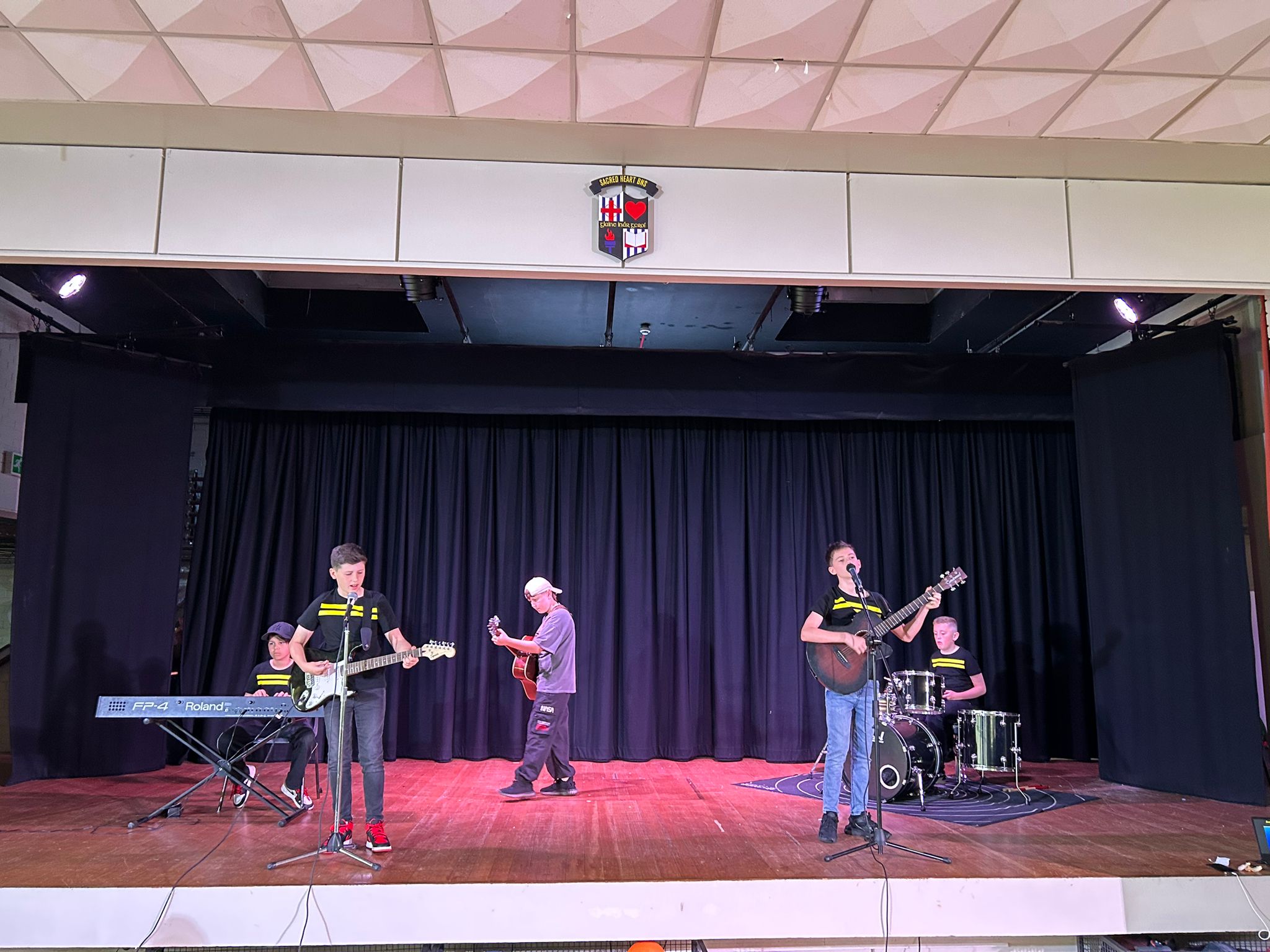 Children music band playing on a stage